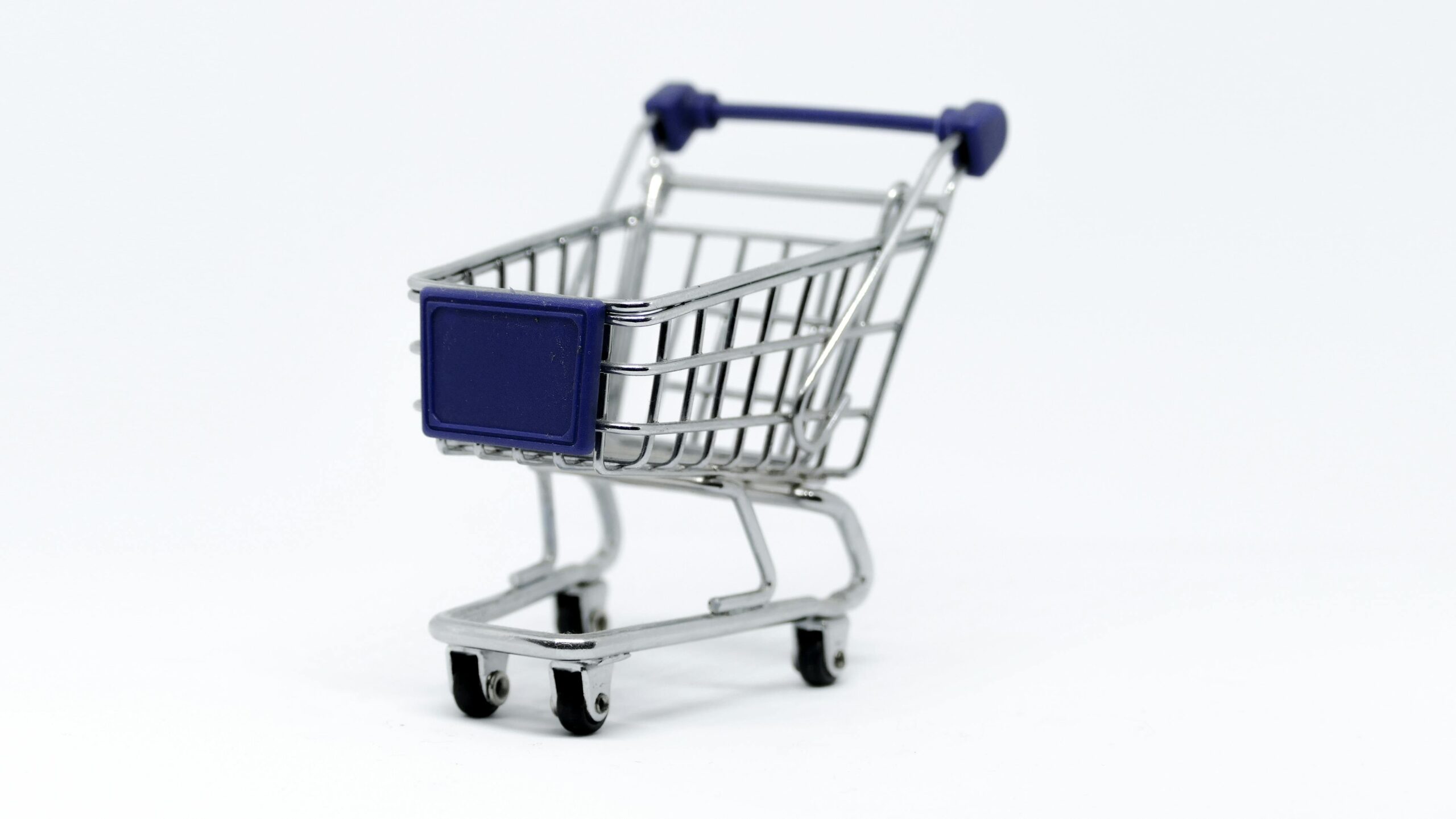 A shopping cart overflowing with healthy groceries marked down due to store coupon usage.