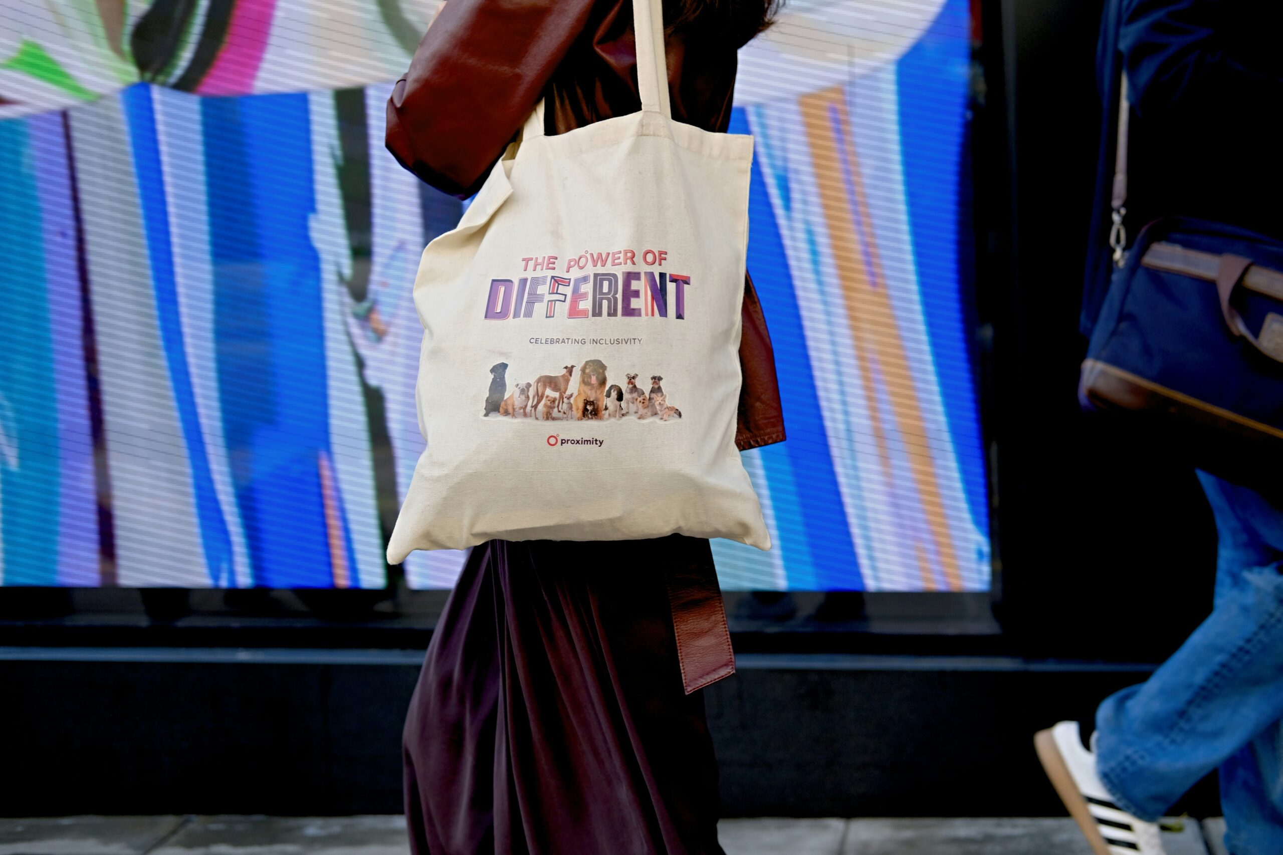 Photo of Sarah holding a shopping basket filled with discounted items