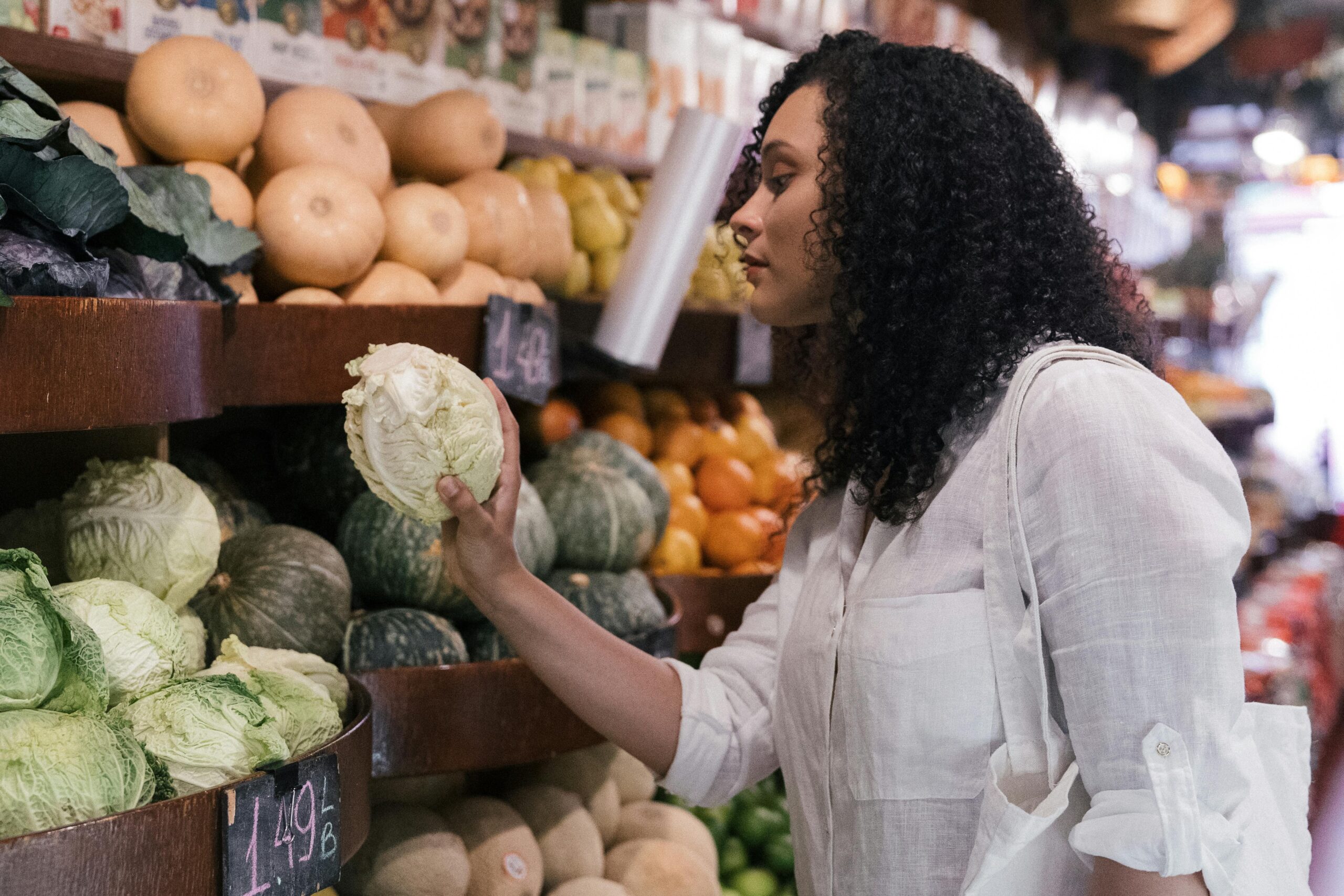 Sarah holding her carefully planned grocery haul under $50