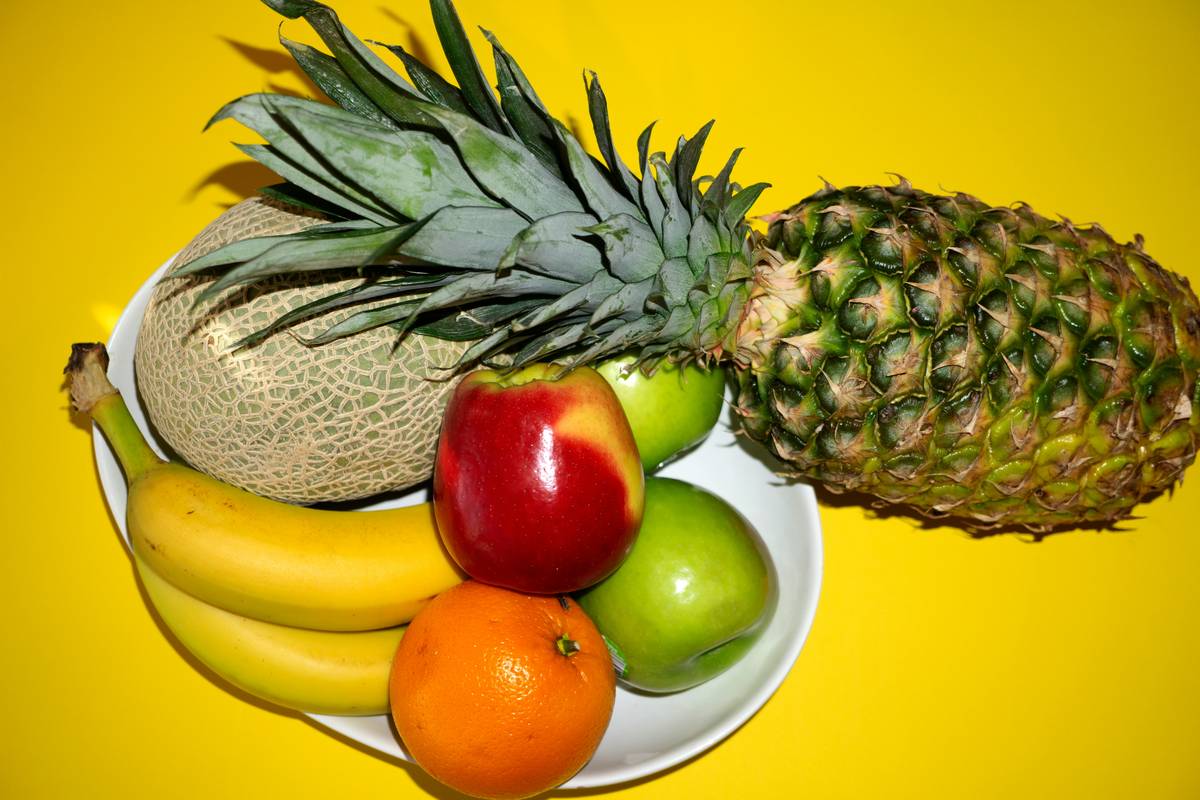 Photograph of assorted vegetables available in large bins for bulk purchasing