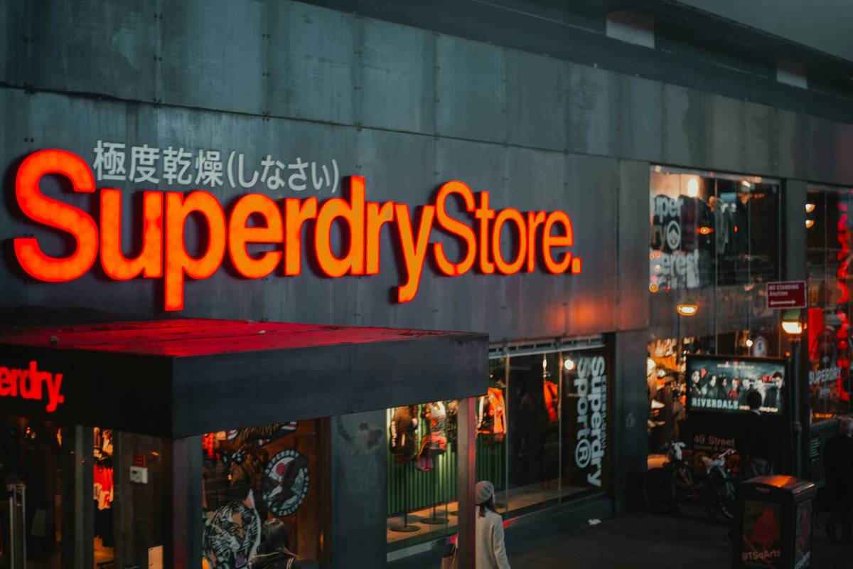 A close-up of a Tops Weekly Ad showing discounts on organic fruits and vegetables.