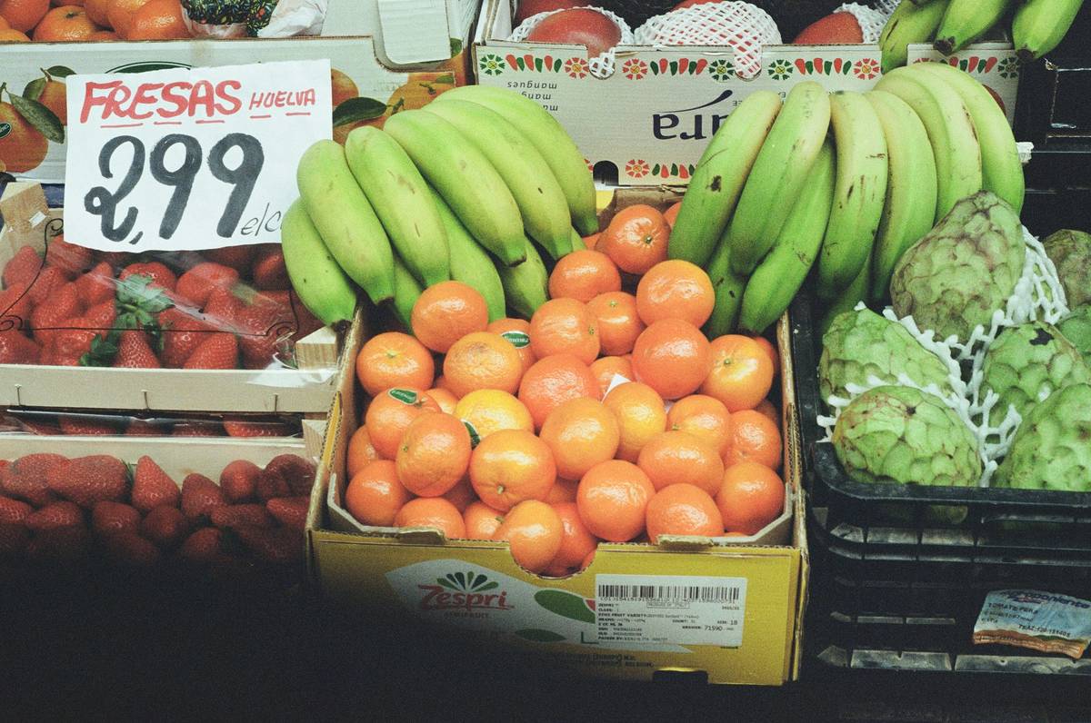 Photo of Sarah holding bags of groceries she purchased on a budget