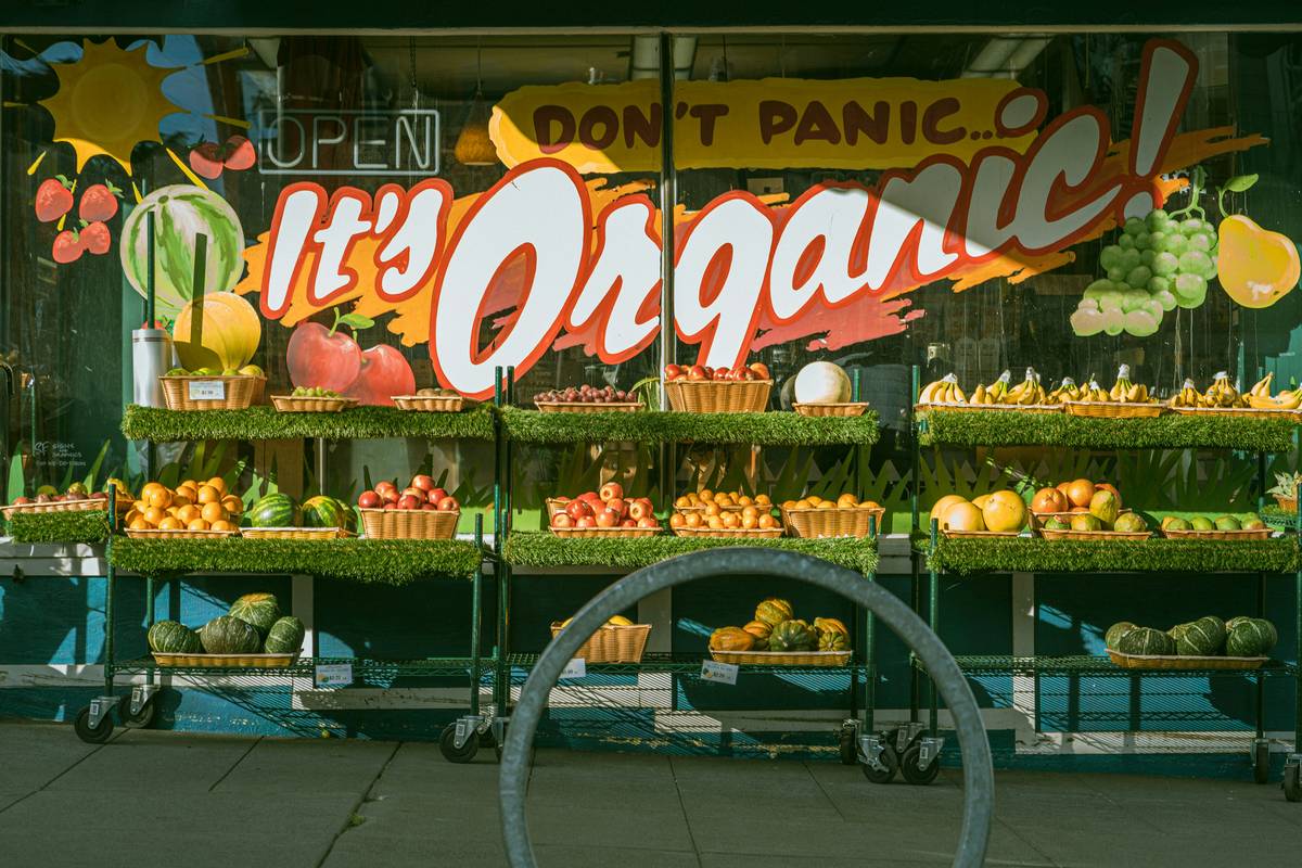 A customer browsing shelves of organic products at a friendly market.