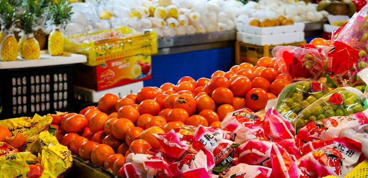 Before and after photos of a family's pantry organized with smart stock tops from TOPS Friendly Markets