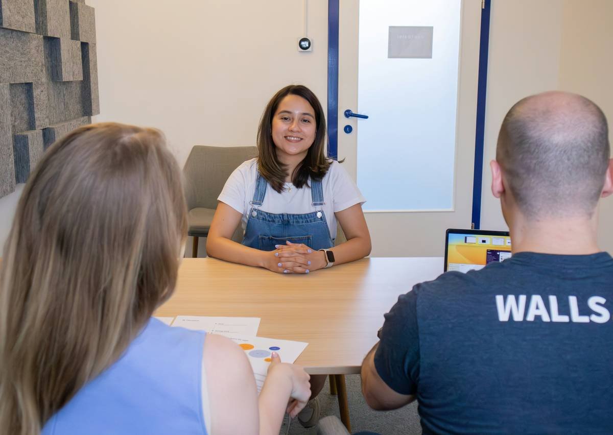 A female job applicant feeling happy during an interview