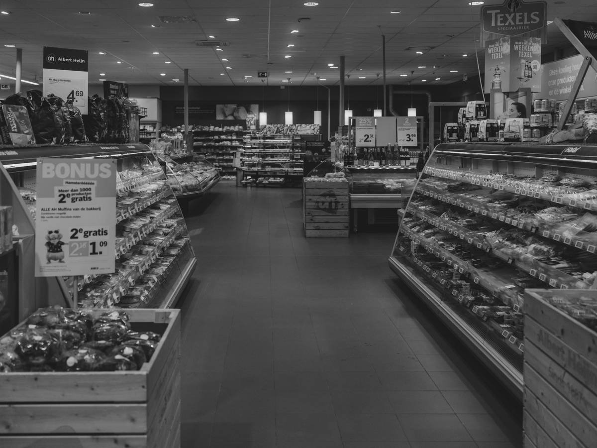 Interior of Tops Friendly Markets Store #607 in Boston, NY showing fresh produce section and Full Circle Market organic products on shelves