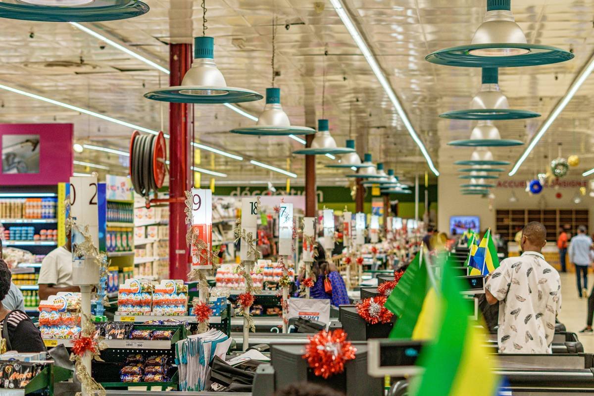 Side-by-side photo: Left cart shows $89 worth of regular-priced healthy items; right cart shows equivalent items using Tops deals totaling $56