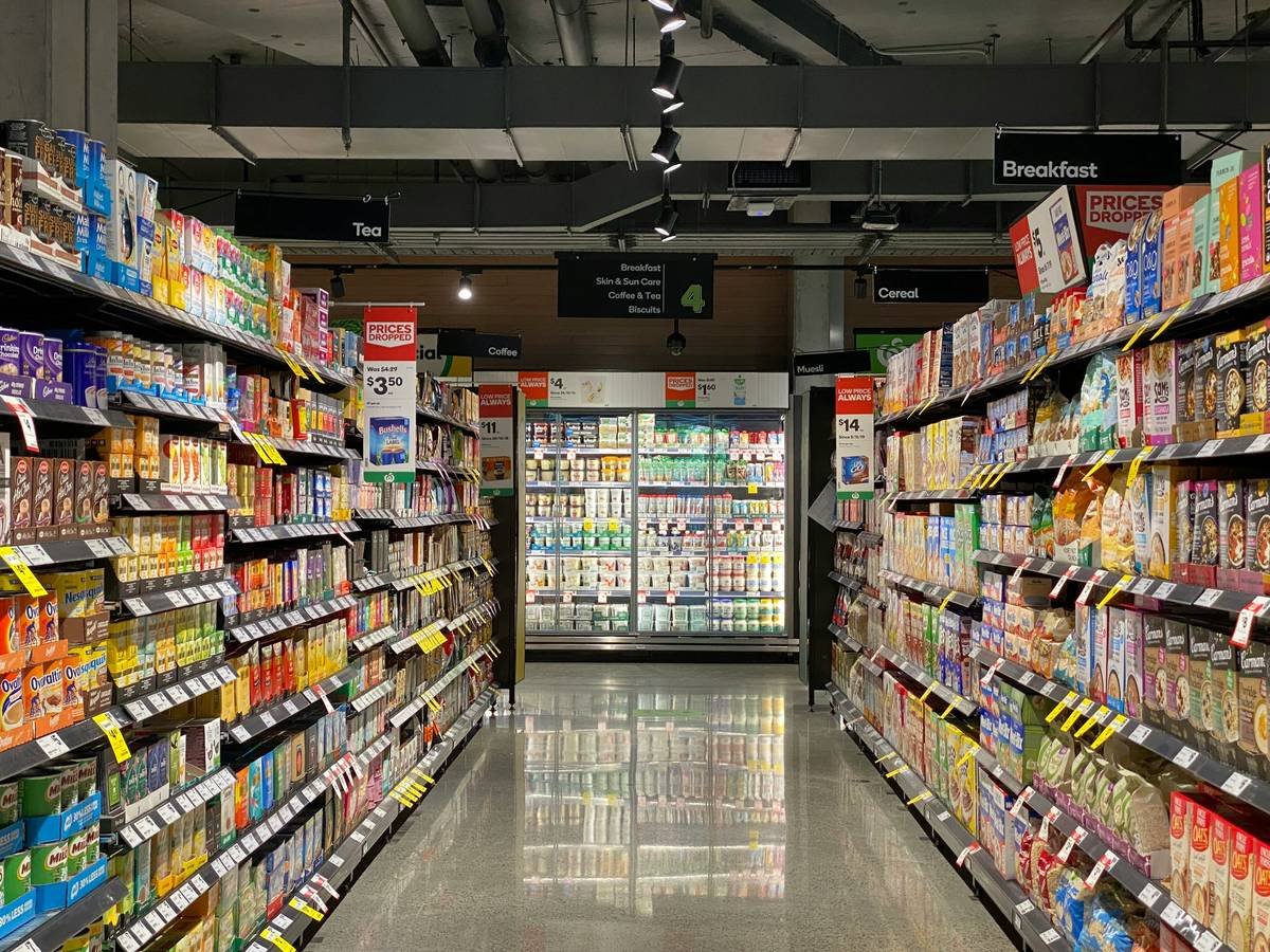 Interior layout of a Tops Friendly Market showing fresh produce section, chilled ready meals, and bulk rice bins