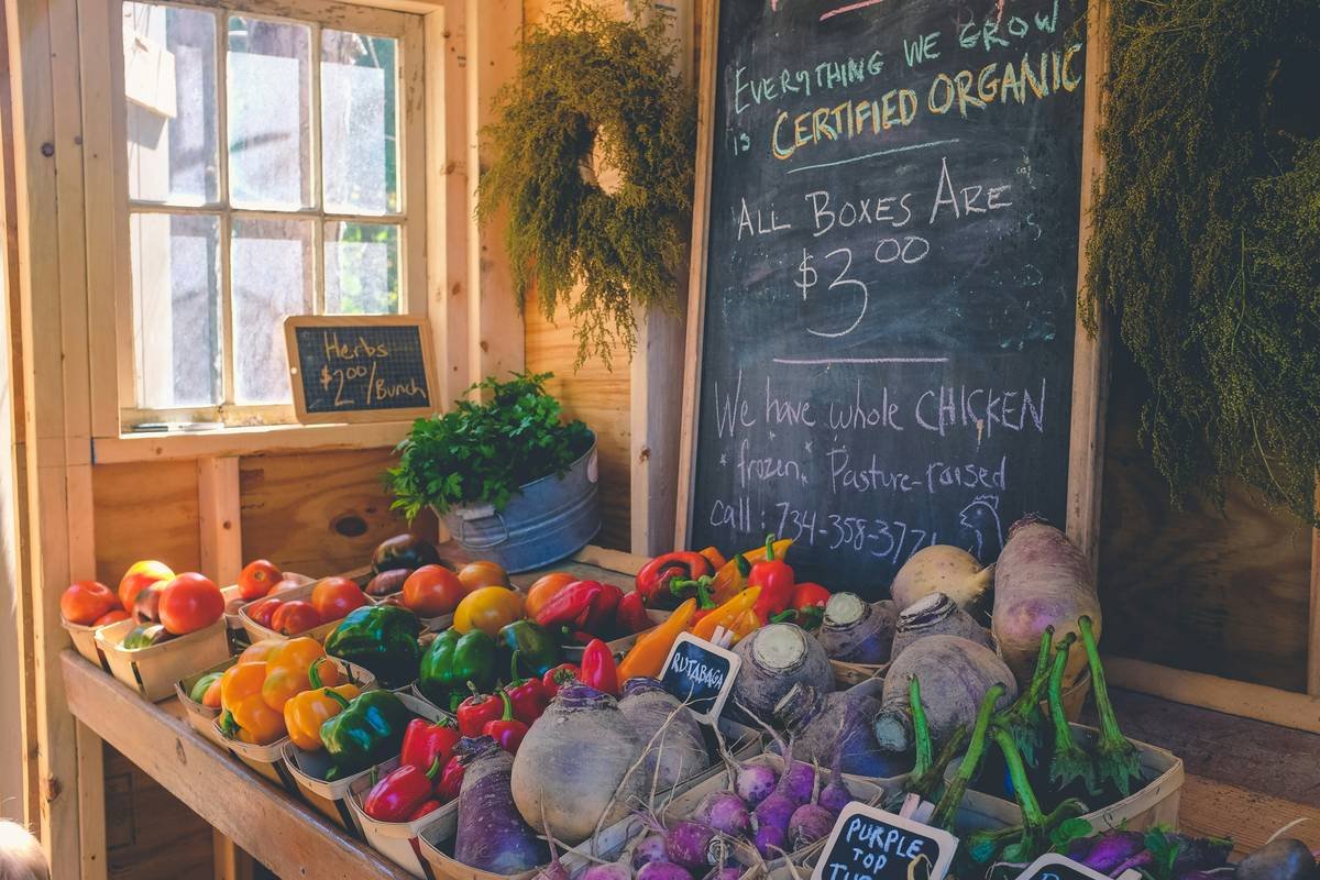 healthy way organic market produce aisle with fresh greens and price tags visible